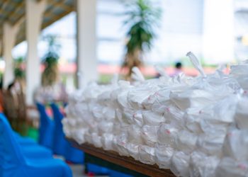 Asian foam food packages are prepare in plastic bag for donation to people.